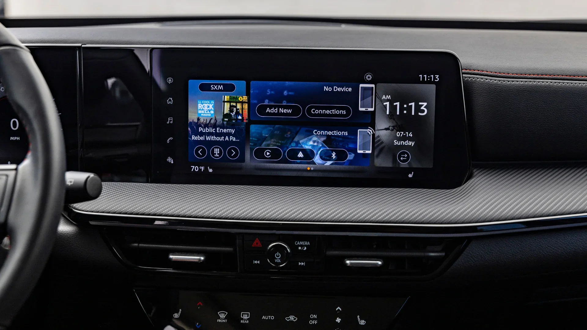 2026 Nissan Kicks® cabin with a wide digital display, light seats and modern two-tone cabin styling.