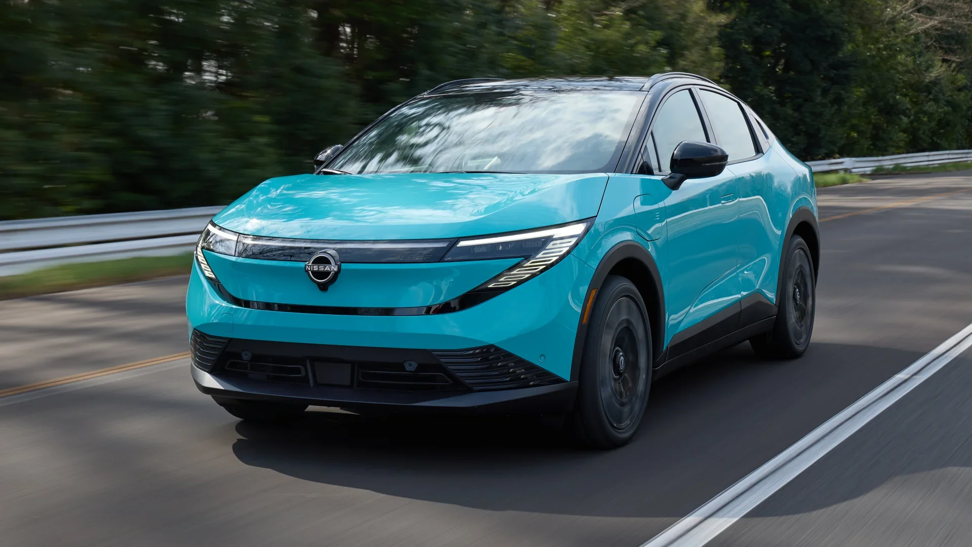 2026 Nissan LEAF® interior with digital dashboard, steering wheel and light premium seating in view.